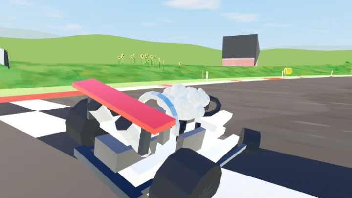 Close up of a kart on the start line with a sheep sitting in the seat