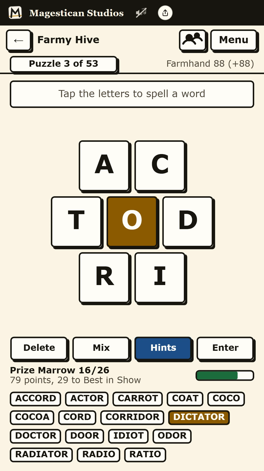 Combword on a phone: the letters around a gold O and the words found so far